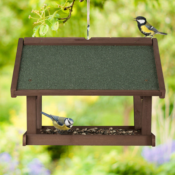 Brown hanging bird feeder wall