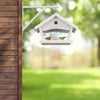 White hanging bird feeder wall