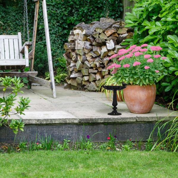 Birdbath on cast iron base