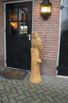 Houtsculptuur uil op stam