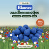 Blauwe zaadbommetjes van bloeirijk in een bloemenweide
