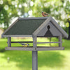 Grey bird feeder on stand