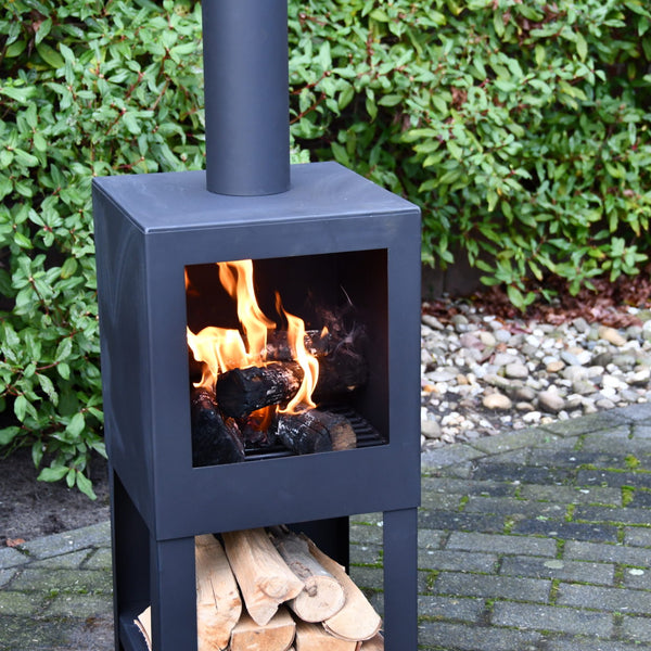 Terrace heater with wood storage