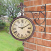 Station clock including thermometer